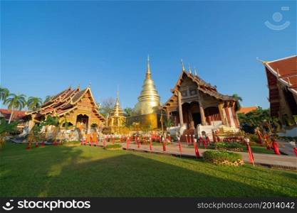 Wat Phra Singh Woramahawihan golden pagoda or stupa of buddhist Temple, Chiang Mai City, Thailand. Thai architecture. Tourist attraction landmark.