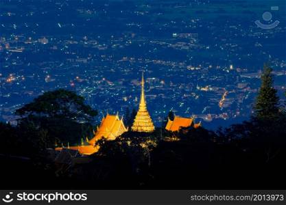 Wat Phra That Doi Suthep, Ratchaworawihan temple pagoda with Chiang Mai Downtown Skyline, Thailand. Financial district in urban city in Asia. Buildings on mountain hill at night.