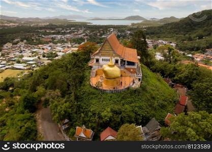 Wat Pra Tat Inkwan Phuket Thailand Kyaik-htiyo Koh Sirey, Phuket, Thailand - April 18, 2019  Terrace of Wat Koh Sirey with the golden stupa and the Andaman Sea