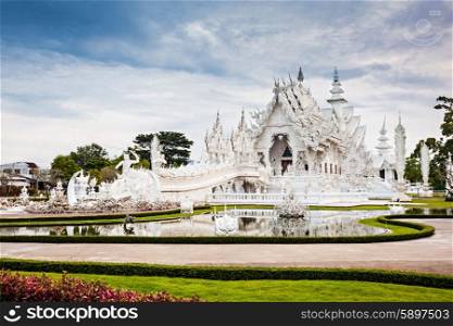 Wat Rong Khun (White Temple) is a contemporary art exhibit in the style of a Buddhist temple in Chiang Rai, Thailand