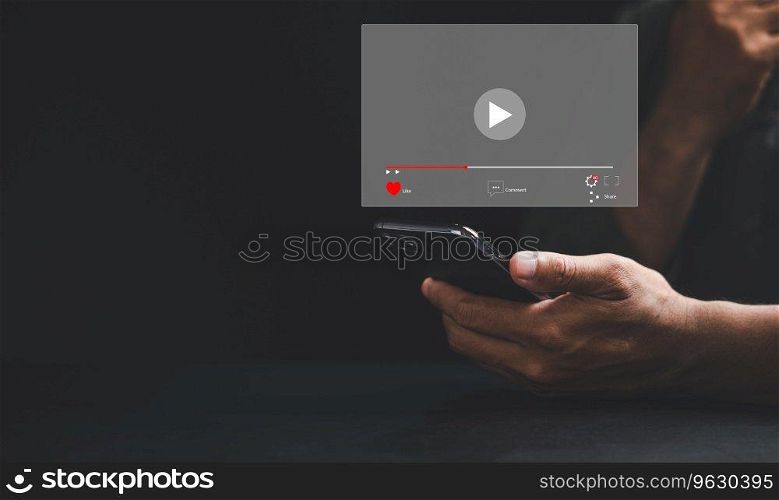 Watch captivating videos on a smartphone screen as a man taps to start live streaming. Immerse yourself in the digital world of technology, social media, and entertainment from the comfort of home.