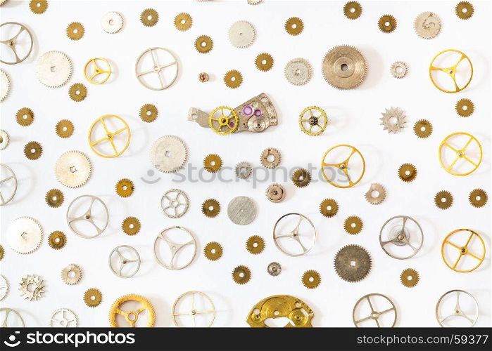 watchmaker workshop - ornament from various old watch spare parts on white background