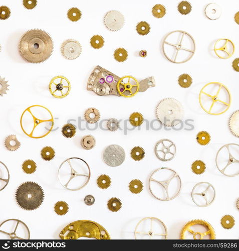 watchmaker workshop - pattern from various old watch spare parts on white background