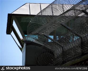 watchtower and barbed wire. watchtower and barbed wire, detail of a prison in Germany
