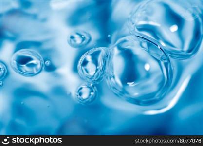 Water and bubbles. Moving surface of the water