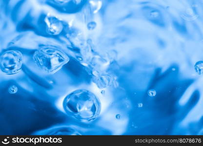 Water and bubbles. Moving surface of the water