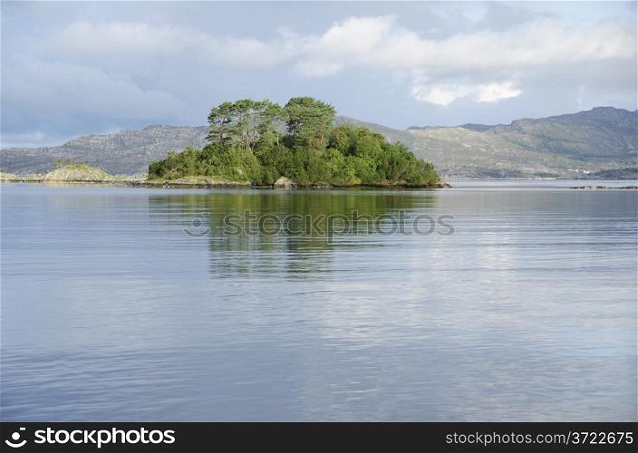 Water and lake with islands and clouds, ocean around Bergen in Norway