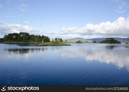 Water and lake with islands and clouds, ocean around Bergen in Norway