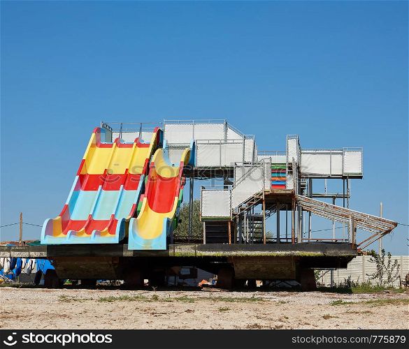 water attraction stands on a sandy coast on a summer day, Ukraine