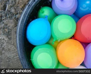 water balloons in a bucket with water