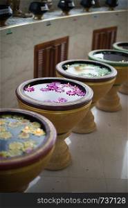 water basin style and flower candle, religion buddhism culture.