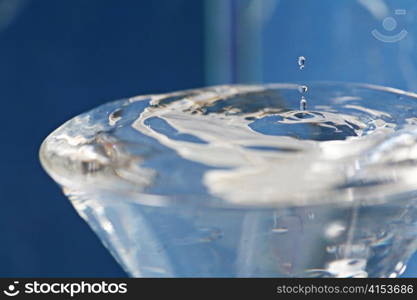 Water being poured in a transparent glass