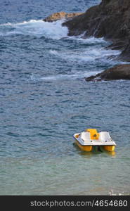 Water bicycles on shore of blue sea