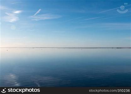 Water calm like a mirror by the coast of the swedish island Oland in the Baltic Sea