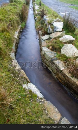 Water channel, old structure. Leat, Dartmoor National Park, Devon, England, United Kingdom.