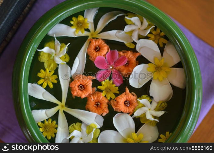 water cup with beautiful flowers, a variety of background colors in spa health and beauty center