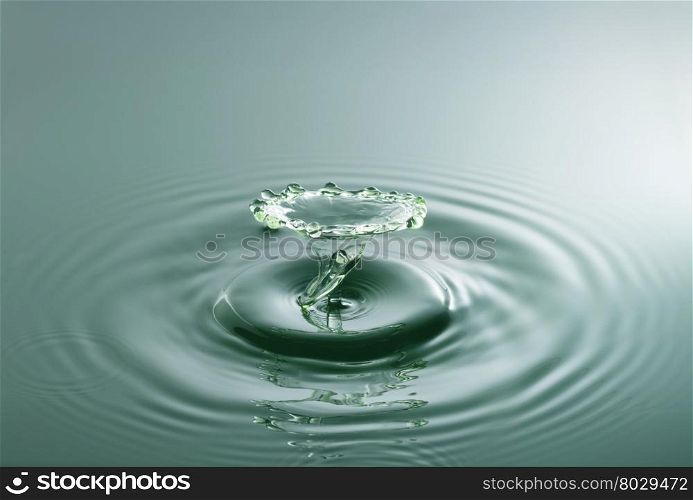 Water drop photography, one or two drops of water dropped from height into water and captured as they hit the water or collide with each other.