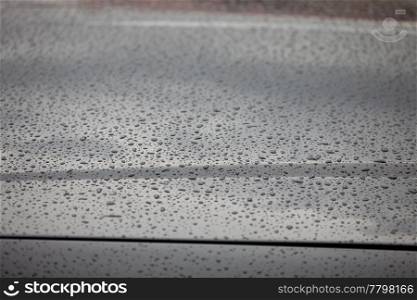 water droplets on the hood of a car