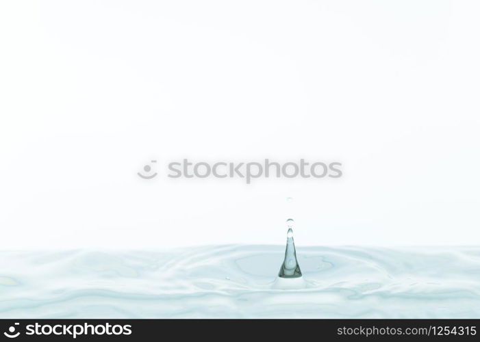 Water drops and water waves in a white background