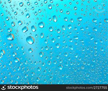 Water drops on a blue surface