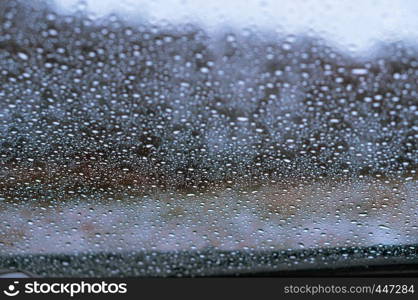 water drops on car glass, rain drops on glass. rain drops on glass, water drops on car glass
