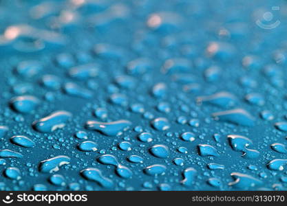 water drops on color background close up