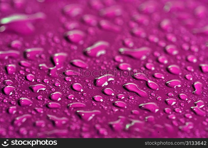 water drops on color background close up
