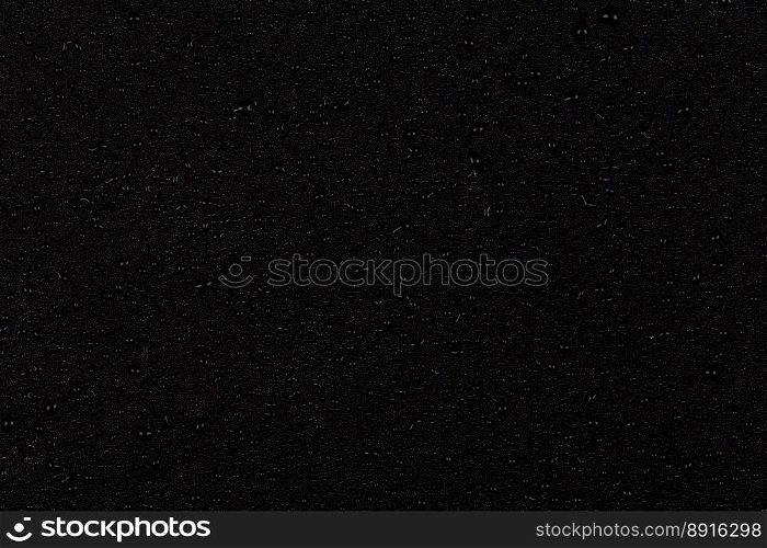 Water drops on dark stone surface texture background