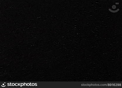 Water drops on dark stone surface texture background