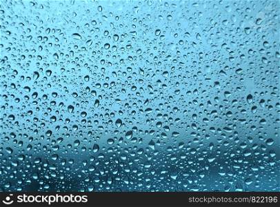 Water drops on glass, natural green texture