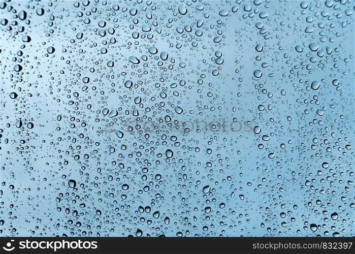 Water drops on glass, natural green texture