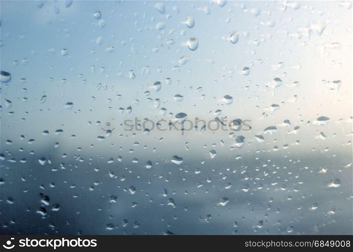 water drops on glass window as background