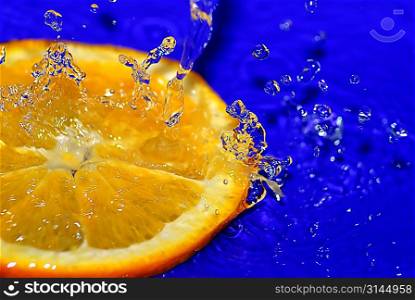 water drops on sliced orange close up