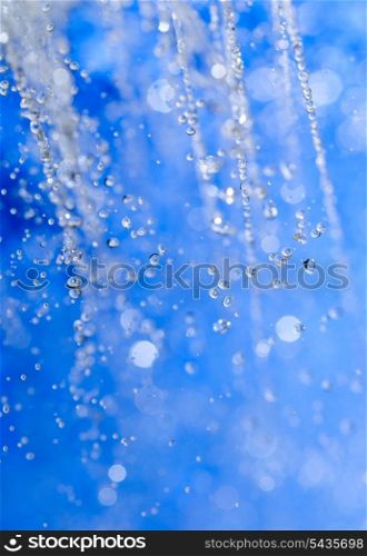 water drops over blue background with copy space