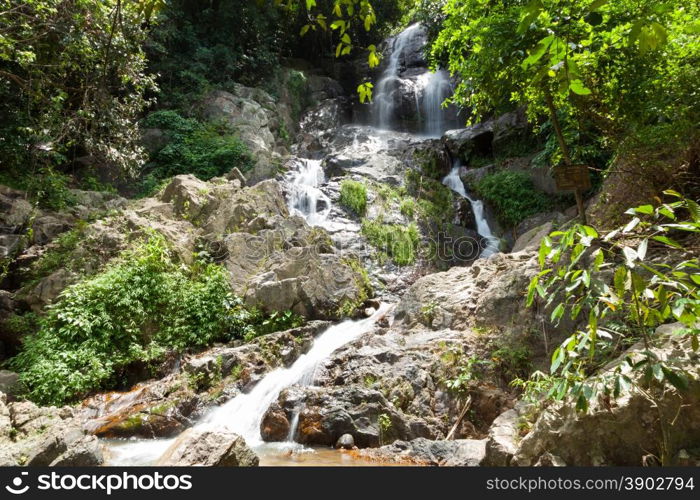 Water falling from a cliff. Water flowing down from the rocks of the waterfall. On Koh Samui