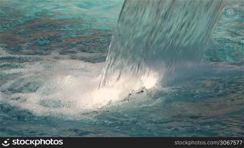 Water falls into the pool