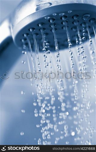 water flowing from metal shower