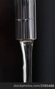 Water flowing out of a faucet
