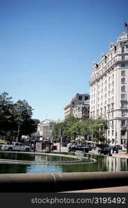 Water fountain in front of buildings, Washington DC, USA