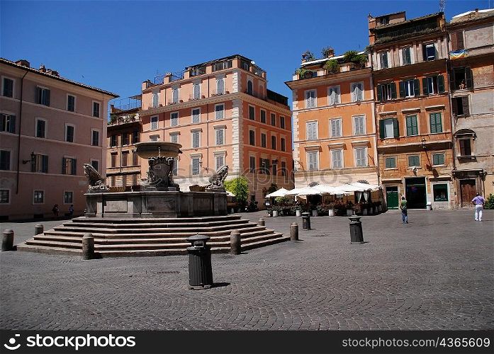 Water fountain in middle of plaza, rome