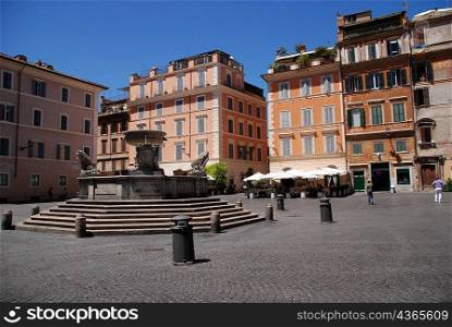 Water fountain in middle of plaza, rome