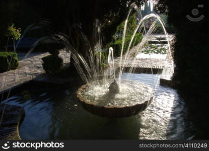 Water fountain in the gardens of the Alhambra, Granada, Andalusia, Spain