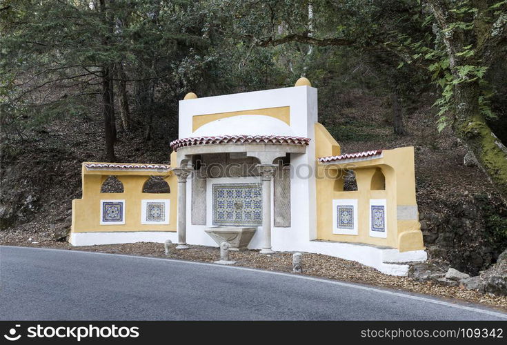 Water fountain of the 19th century located on the road side between Sintra village and Monserrate palace, in Sintra Mountain, Portugal