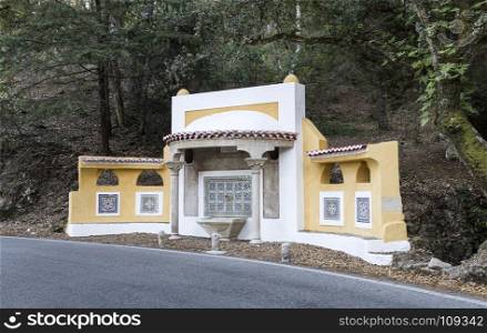 Water fountain of the 19th century located on the road side between Sintra village and Monserrate palace, in Sintra Mountain, Portugal