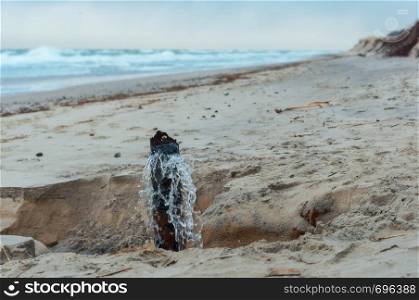 water from sewer pipe, wastewater on the seashore. wastewater on the seashore, water from sewer pipe