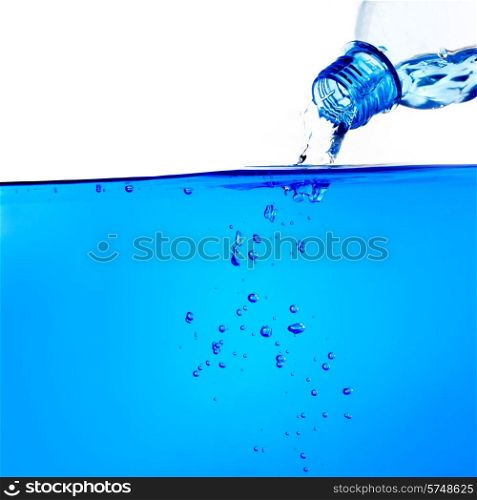 Water from water bottle with bubble forming. Water from bottle