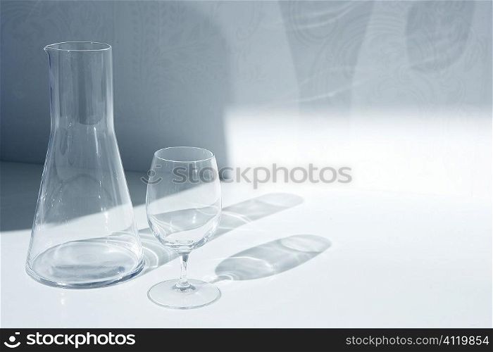 Water glass and bottle with transparent shadows