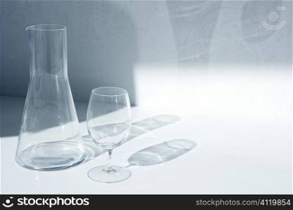 Water glass and bottle with transparent shadows