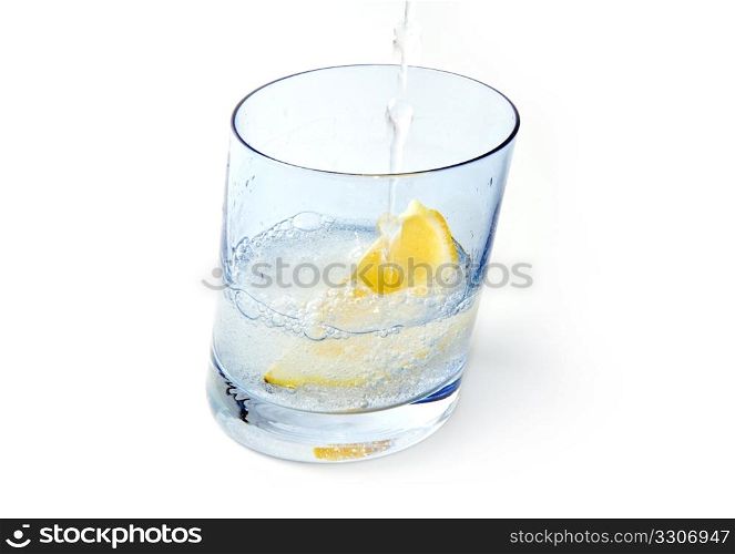 Water glass with ice & lemon isolated on white