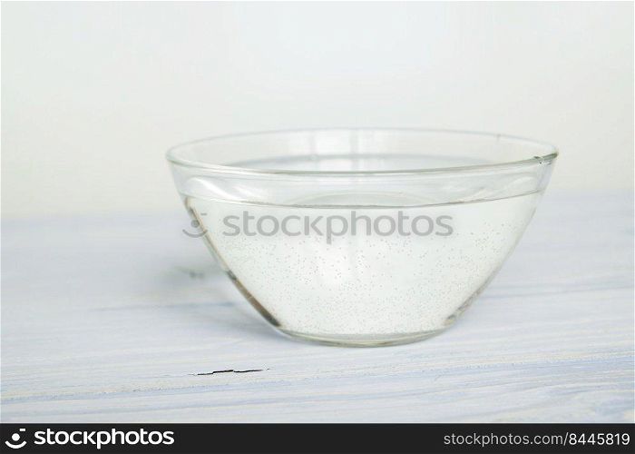 water in a bowl on a white background